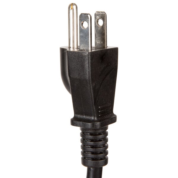 A black power cord plugged into a Town Oshibori towel steamer.