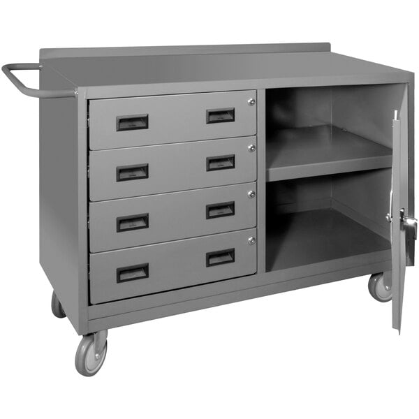 A grey metal cabinet with a door open and drawers inside on wheels.