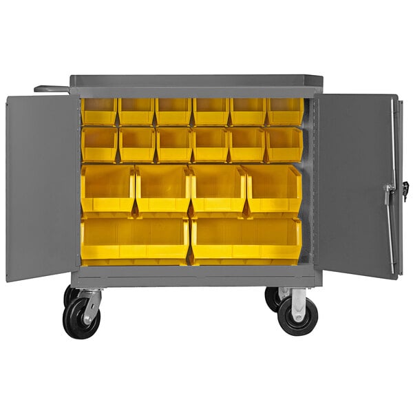 A grey metal cart with yellow bins inside.