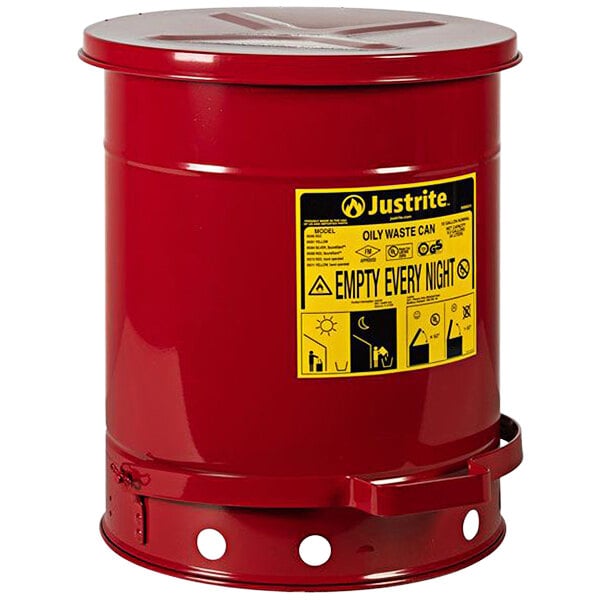 A red Justrite oily waste can with a yellow label.