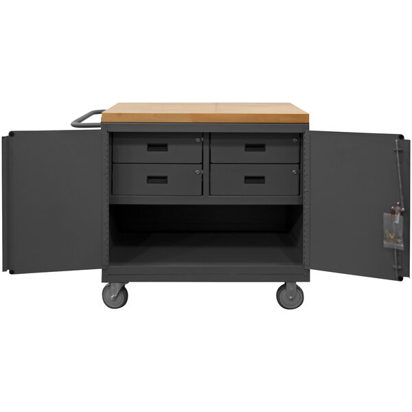 A metal mobile workstation with a maple top and drawers on wheels.