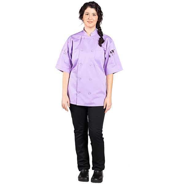 A woman wearing a purple chef's uniform.