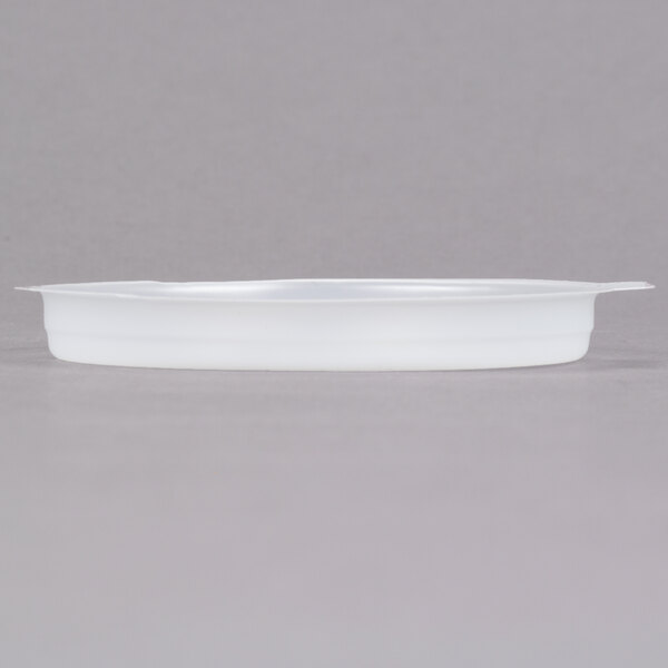 A white plastic lid on a white Cambro mug.