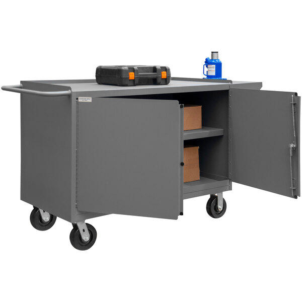 A gray Durham Mfg mobile steel workstation with a toolbox on top.