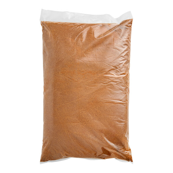 A brown bag of Florida Crystals Organic Dark Brown Cane Sugar on a white background.
