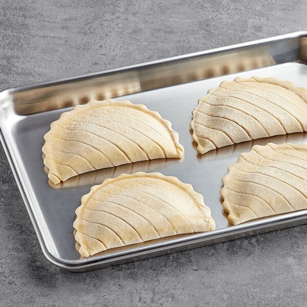White Toque Ready to Bake Apple Turnovers on a baking tray.