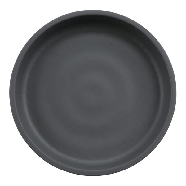 A round, matte black and gray plate with a simple, smooth design.