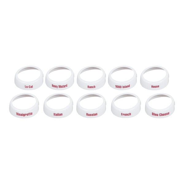 A set of ten white plastic salad dressing dispenser collars with maroon lettering indicating different dressing types.