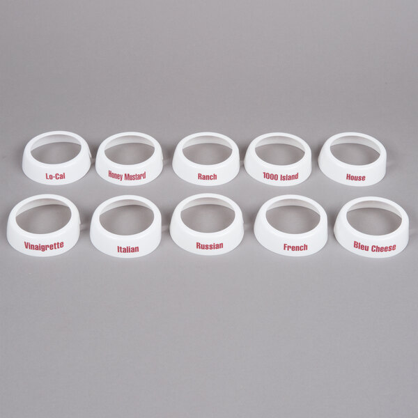 A Tablecraft white plastic salad dressing dispenser collar set with maroon lettering.
