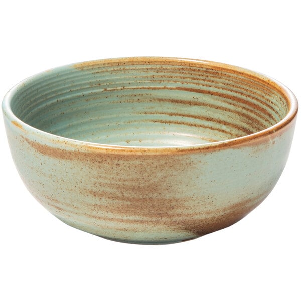 A close up of a teal speckled Bon Chef Tavola Lago cereal bowl.