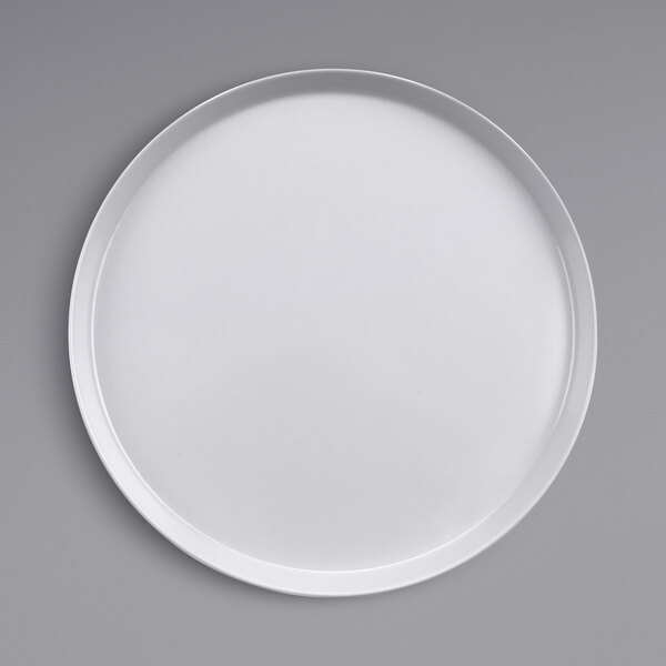 A GET Diamond White raised rim melamine plate on a gray surface.