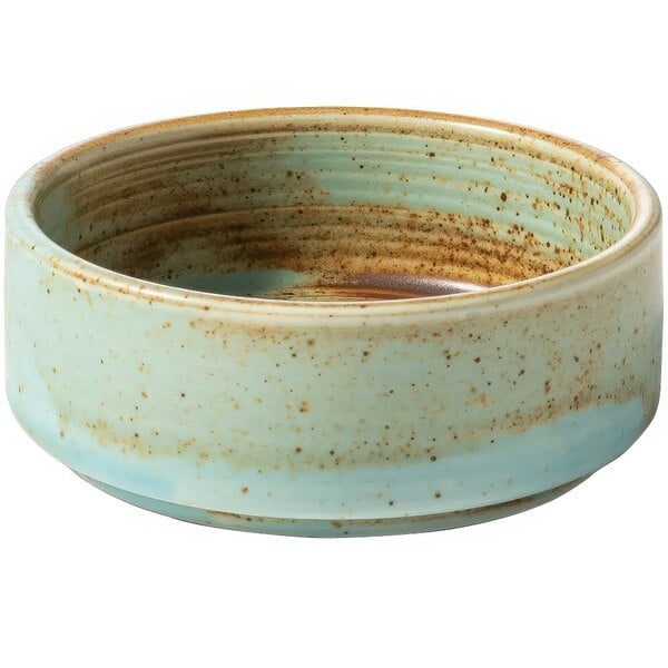 A teal porcelain Bon Chef ramekin with brown specks.