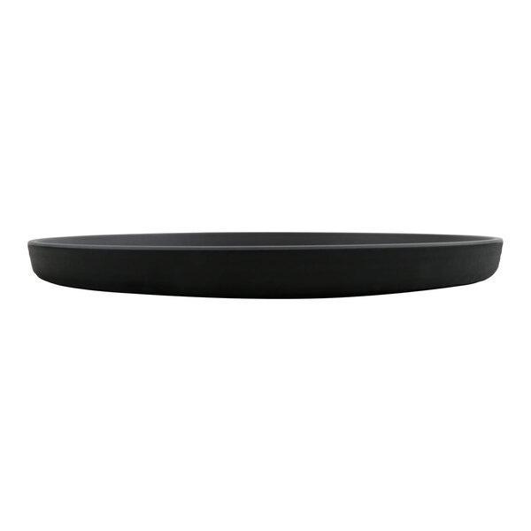A round, flat, black plate with a matte finish, viewed from the side.