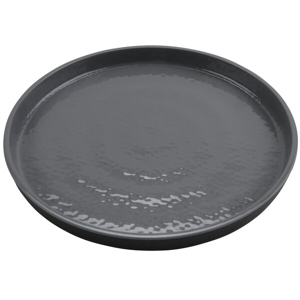 A round gray plate with a textured surface.