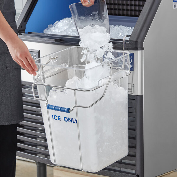 A woman pouring ice into a container using a Vigor ice tote.