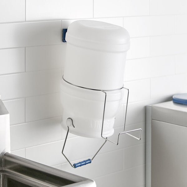 A white polypropylene ice tote with a metal filling hanger.