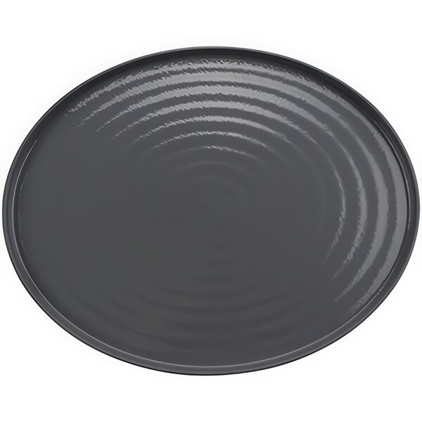 A gray oval platter with a ripples on the surface.