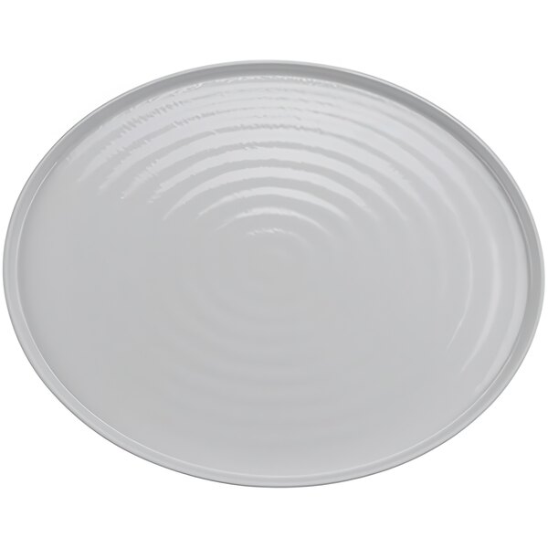 A white oval melamine platter with a spiral pattern.