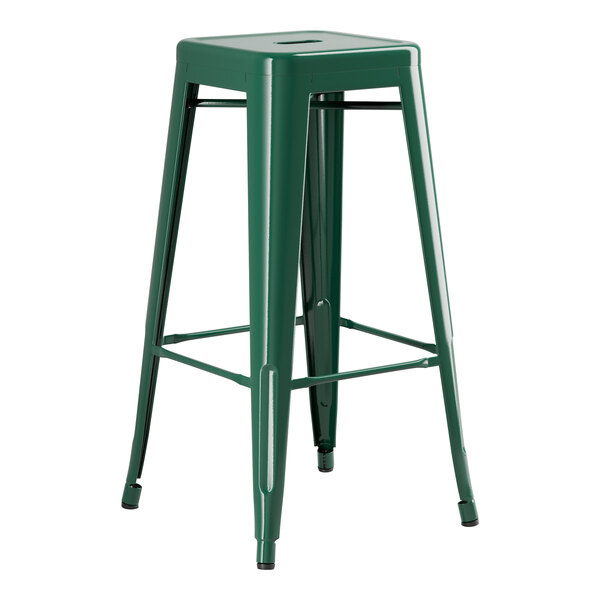 A green metal Lancaster Table & Seating backless barstool with a seat.