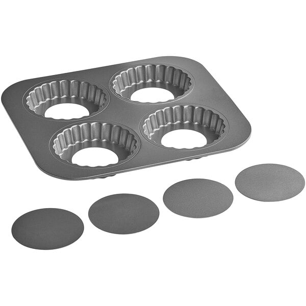 A Baker's Mark non-stick carbon steel quiche pan with 4 compartments.