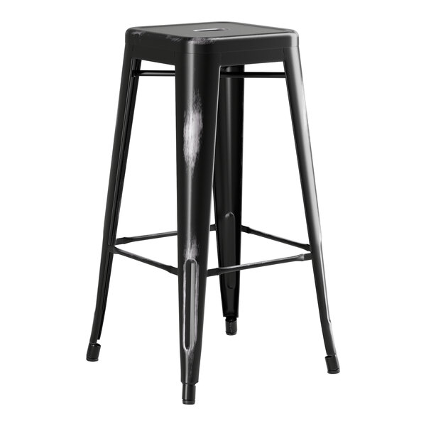 A black metal Lancaster Table & Seating barstool with legs.