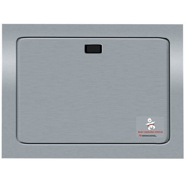 A stainless steel rectangular surface with a black button.