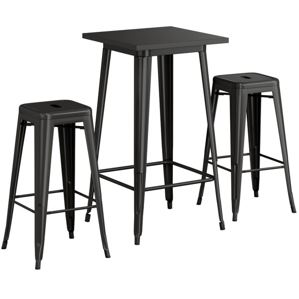 A Lancaster Table & Seating black outdoor bar table with two black backless bar stools.