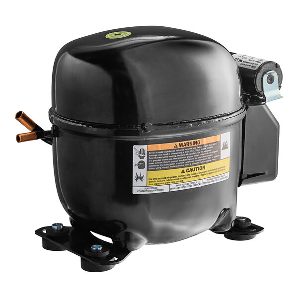 A black refrigeration compressor with a yellow label.