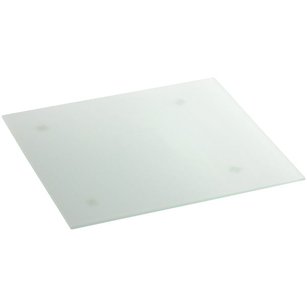 A white square glass plate with dots on the bottom.