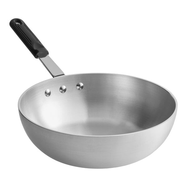 An 11-inch aluminum stir fry pan with a black silicone handle.