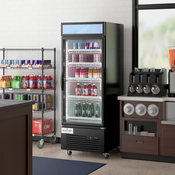 A Main Street Equipment swing glass door refrigerator full of drinks.