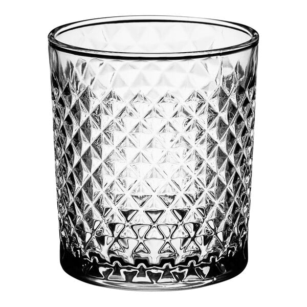 A close up of an Acopa Aurelius clear glass with a diamond pattern.