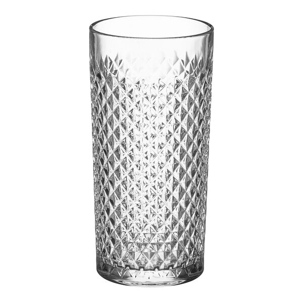 A close-up of an Acopa Aurelius clear beverage glass with a diamond pattern.