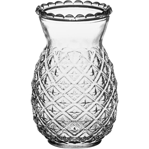 A clear Acopa glass with a pineapple pattern.
