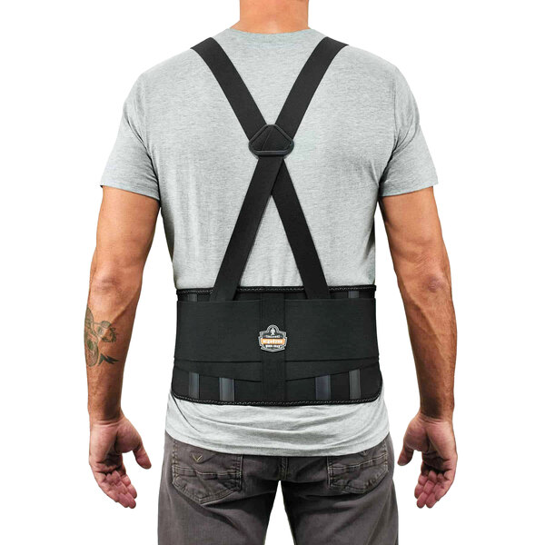 A back view of a man wearing an Ergodyne ProFlex 1625 black back support brace.
