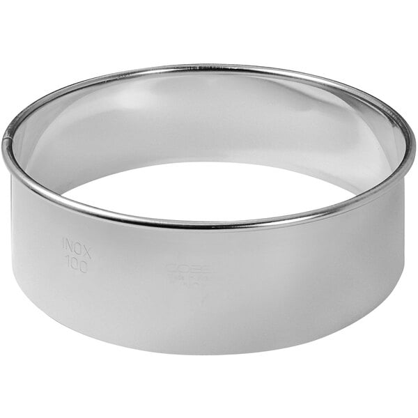 A stainless steel Gobel round pastry cutter set with white background.