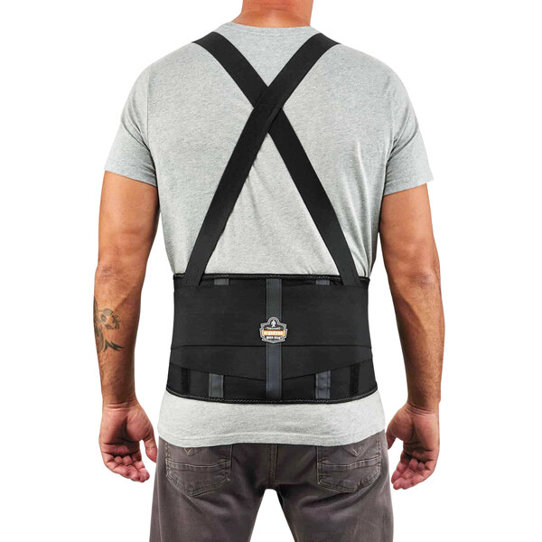 A back view of a person wearing an Ergodyne ProFlex 1000SF black back support brace.
