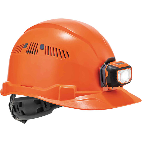 An orange Ergodyne Skullerz hard hat with a light on it.