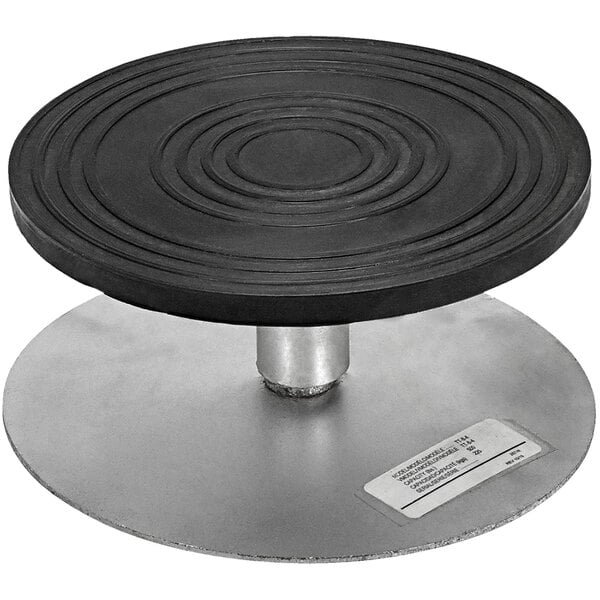 A black circular Turntable with a metal base.