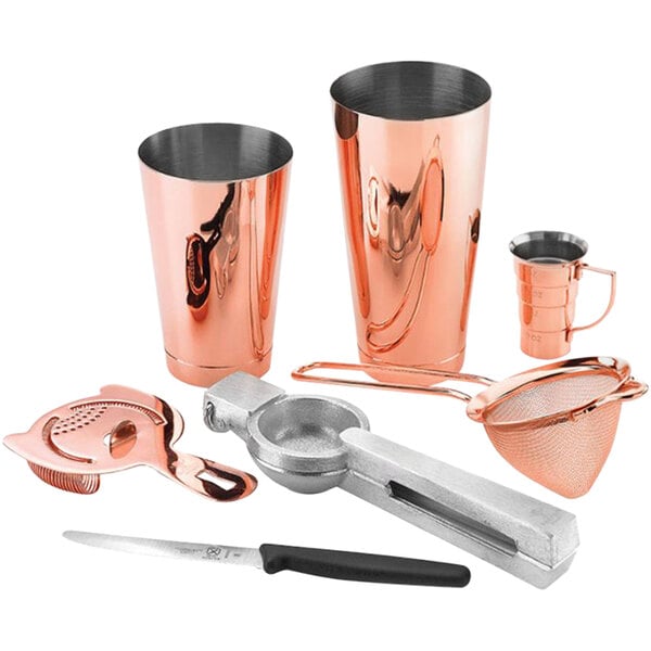 A Barfly copper cocktail tool kit on a counter.