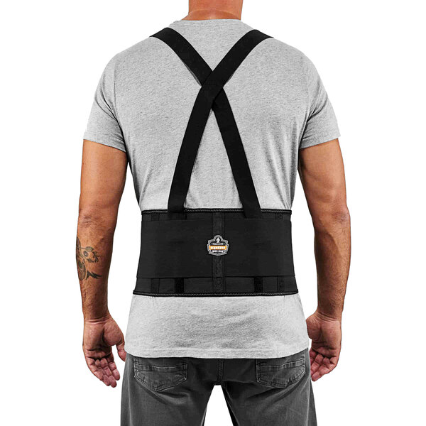 A man wearing an Ergodyne back support belt with black straps.
