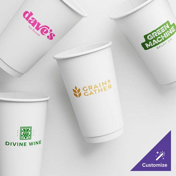 A group of white customizable paper hot cups with different colored logos.