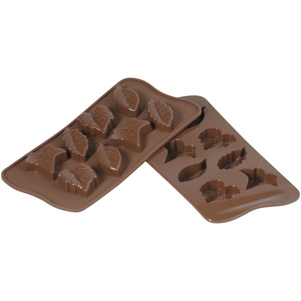 A Silikomart brown silicone chocolate mold with leaf designs.