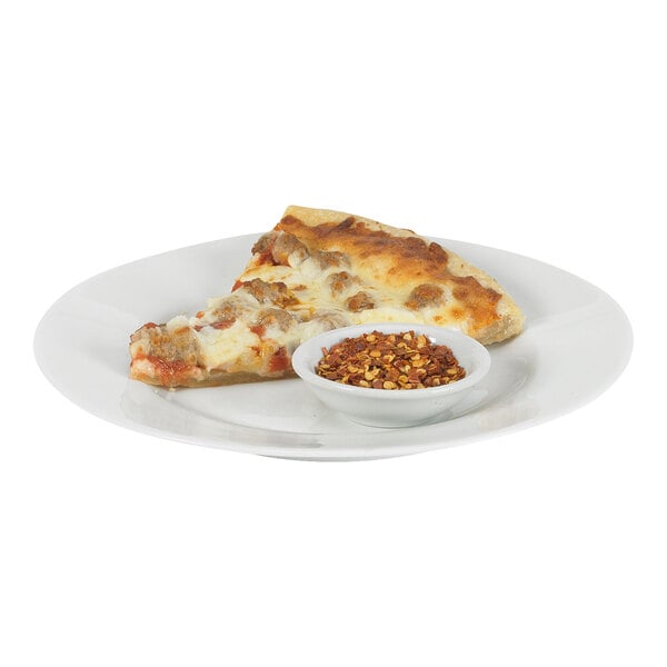 A slice of pizza with a bowl of Crushed Red Pepper packets.