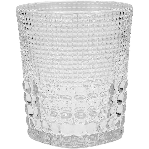 A Fortessa Malcolm clear glass rocks glass with a textured pattern.