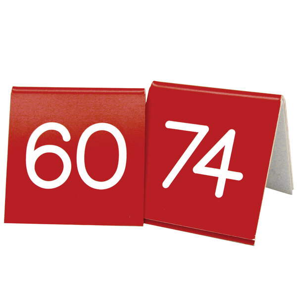 A red table number with white numbers on it.