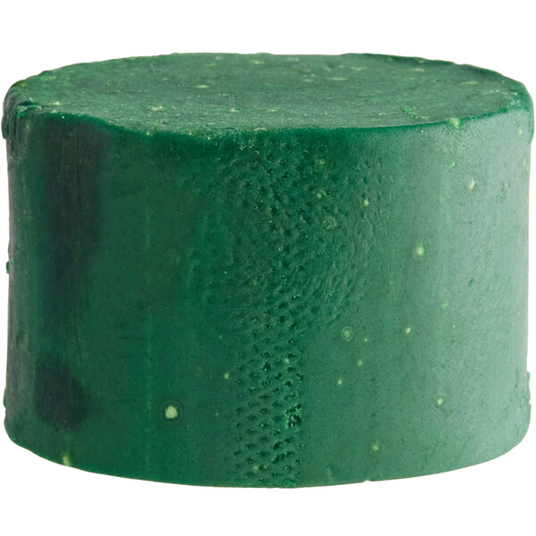 A green cylinder shaped block of Noble Eco Enzo-Kleen Enzymatic grease trap maintainer.
