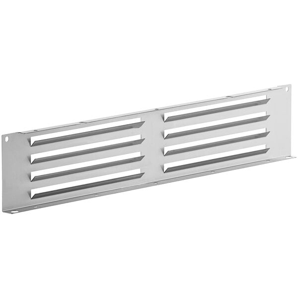A white metal grille with silver metal and four holes.