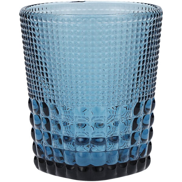 A close up of a Fortessa Malcolm blue glass with a black rim.