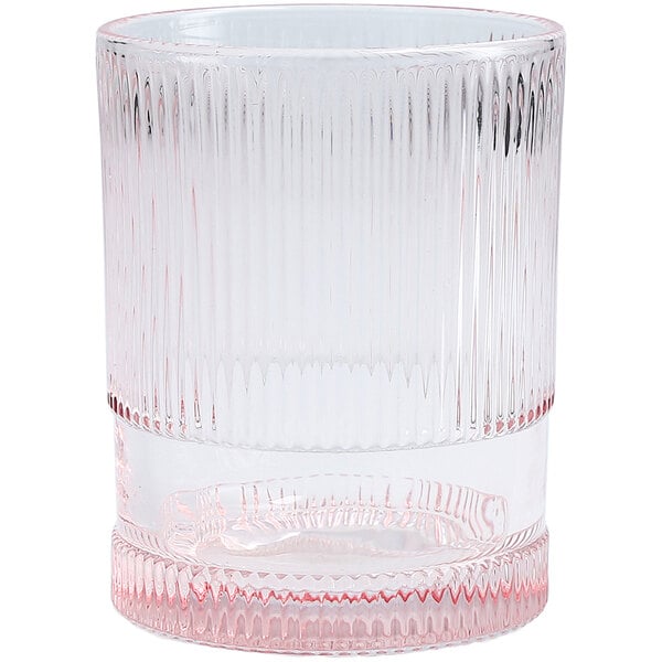 A clear glass with a pink rim.